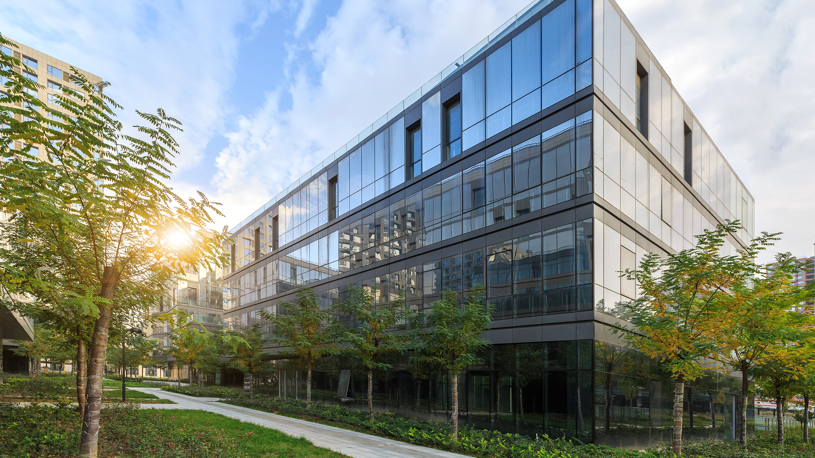 exterior shot of a glass building and courtyard