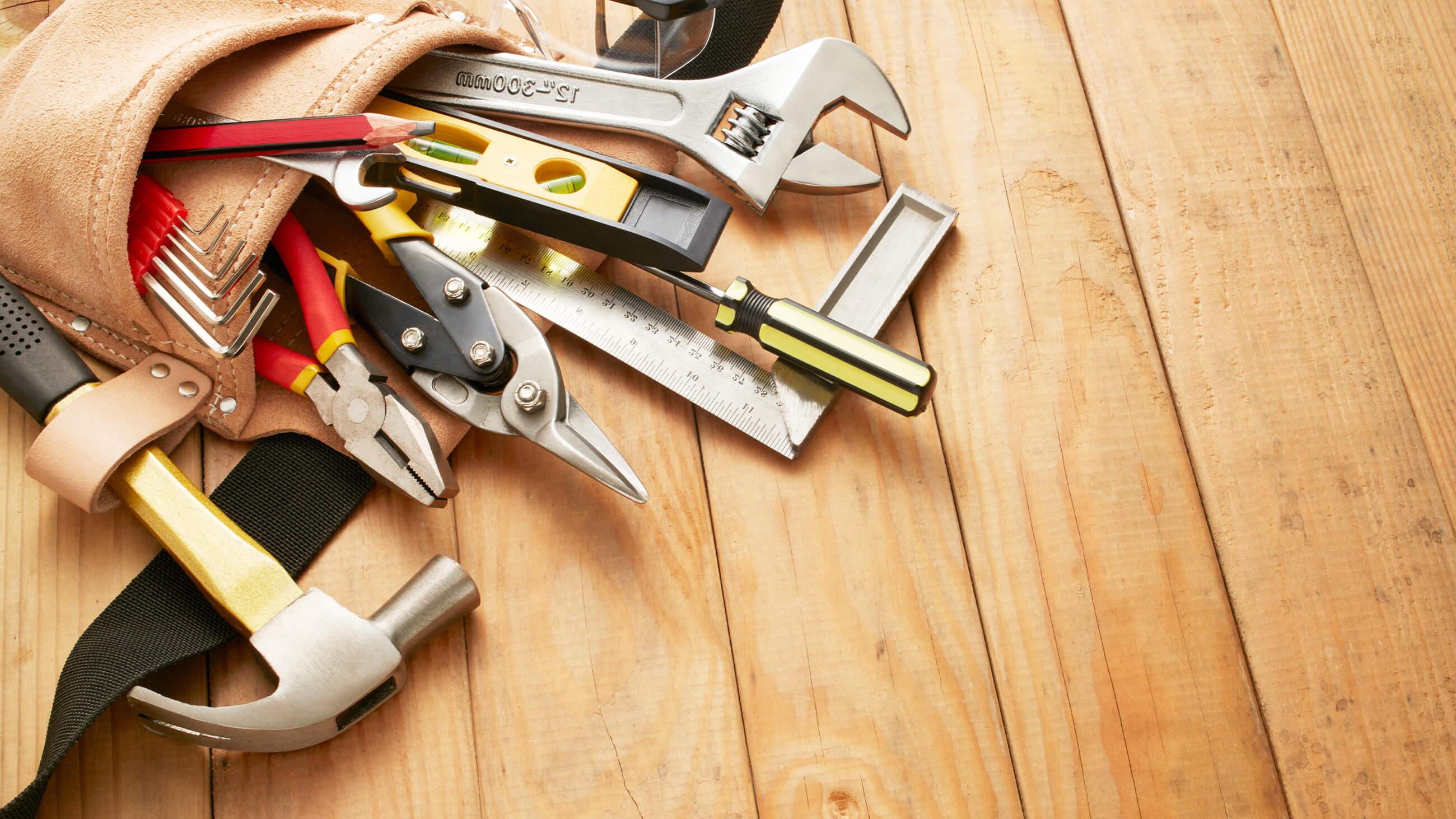 tools laid out on a wooden floor